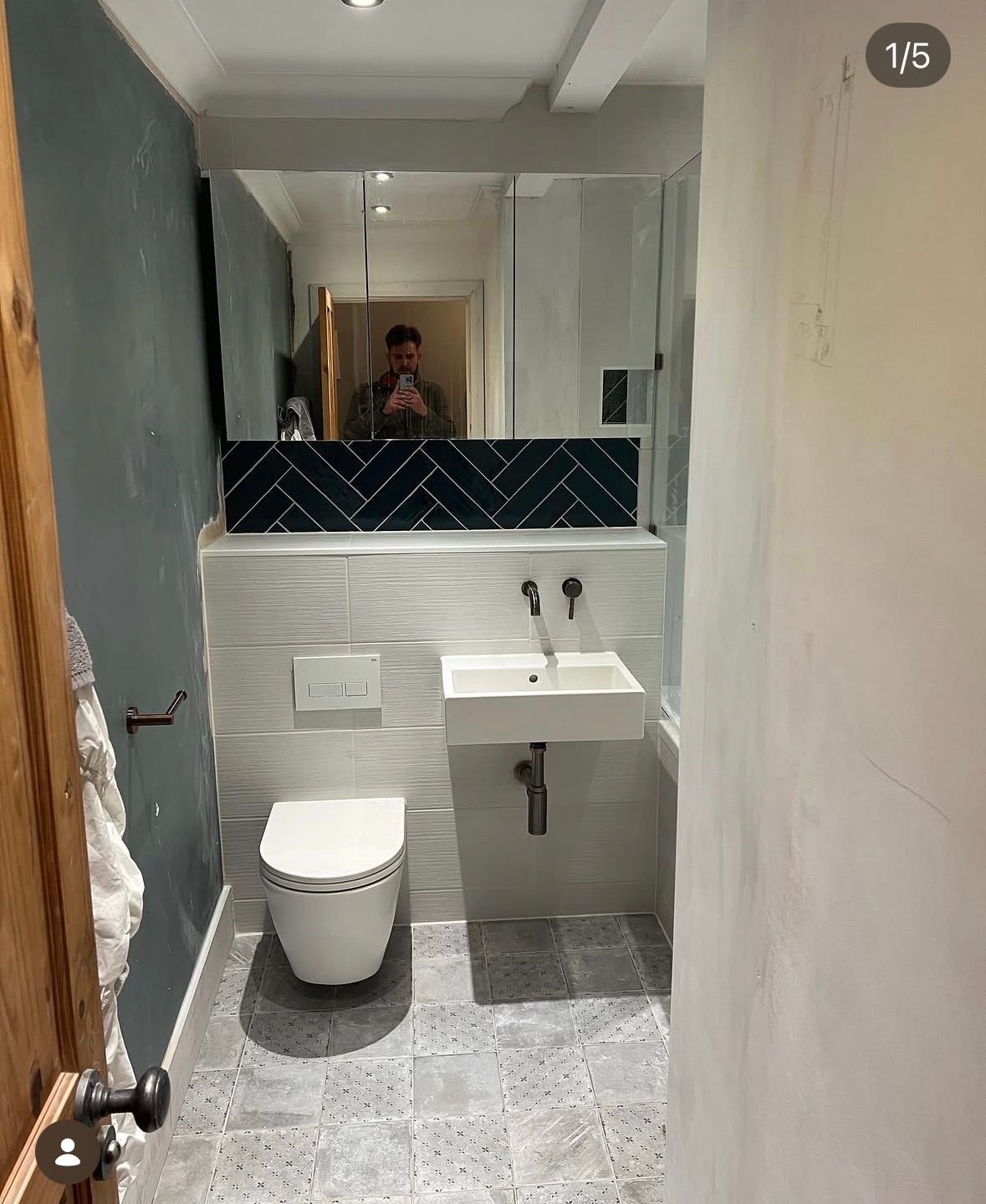 Modern bathroom with chevron feature tiling