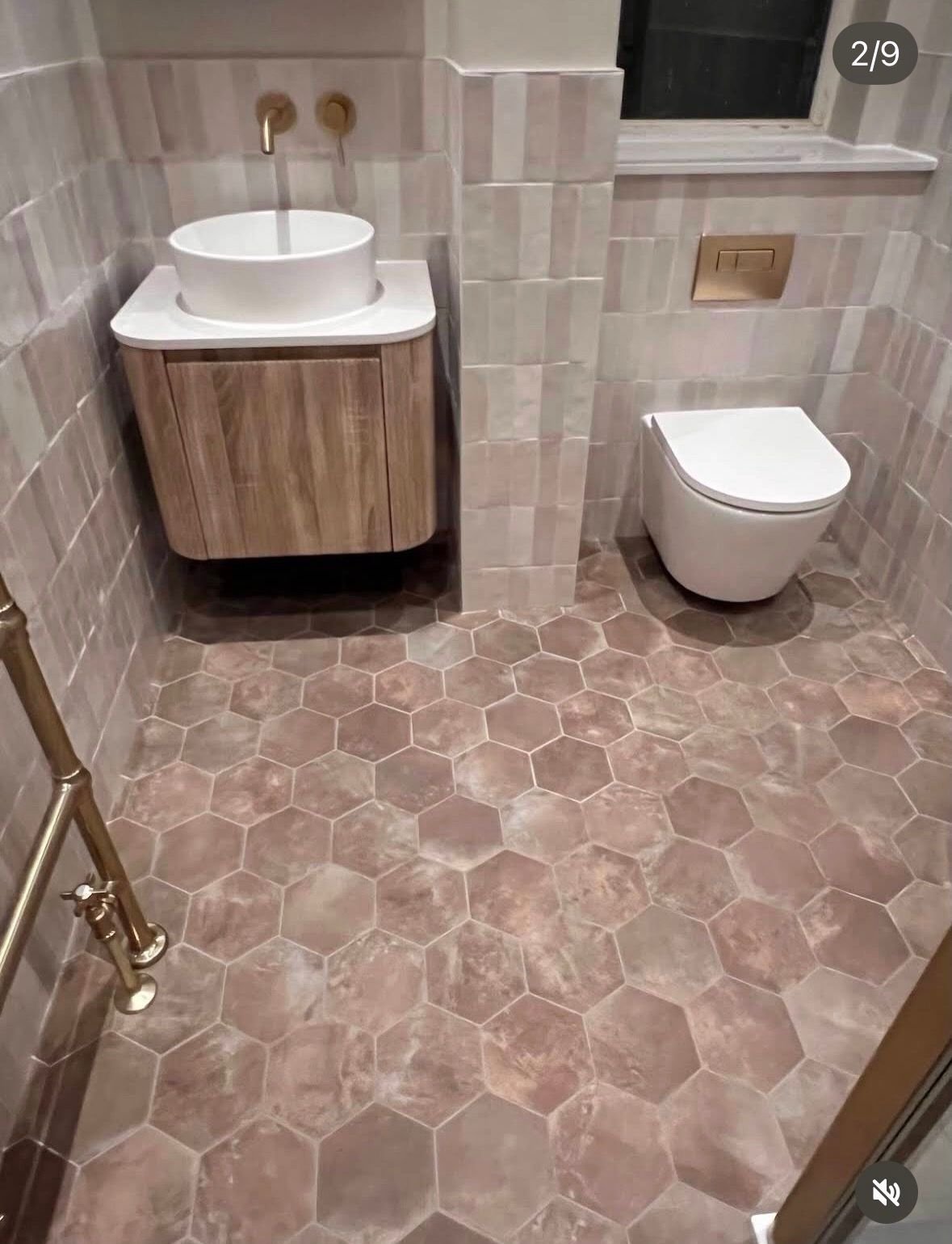 Hexagon tiled floor with wall-hung vanity and toilet