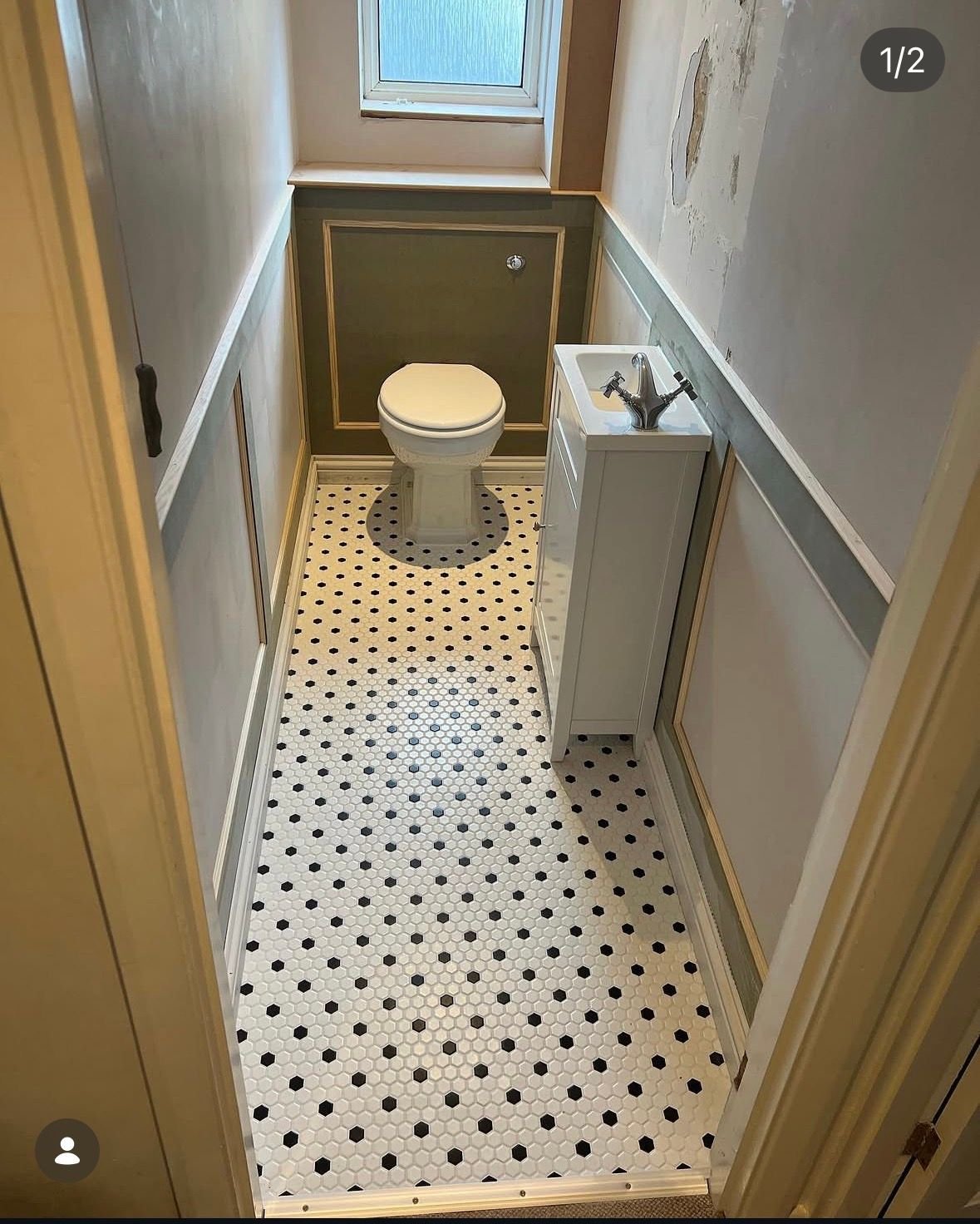 WC with patterned tiled floor and panelling