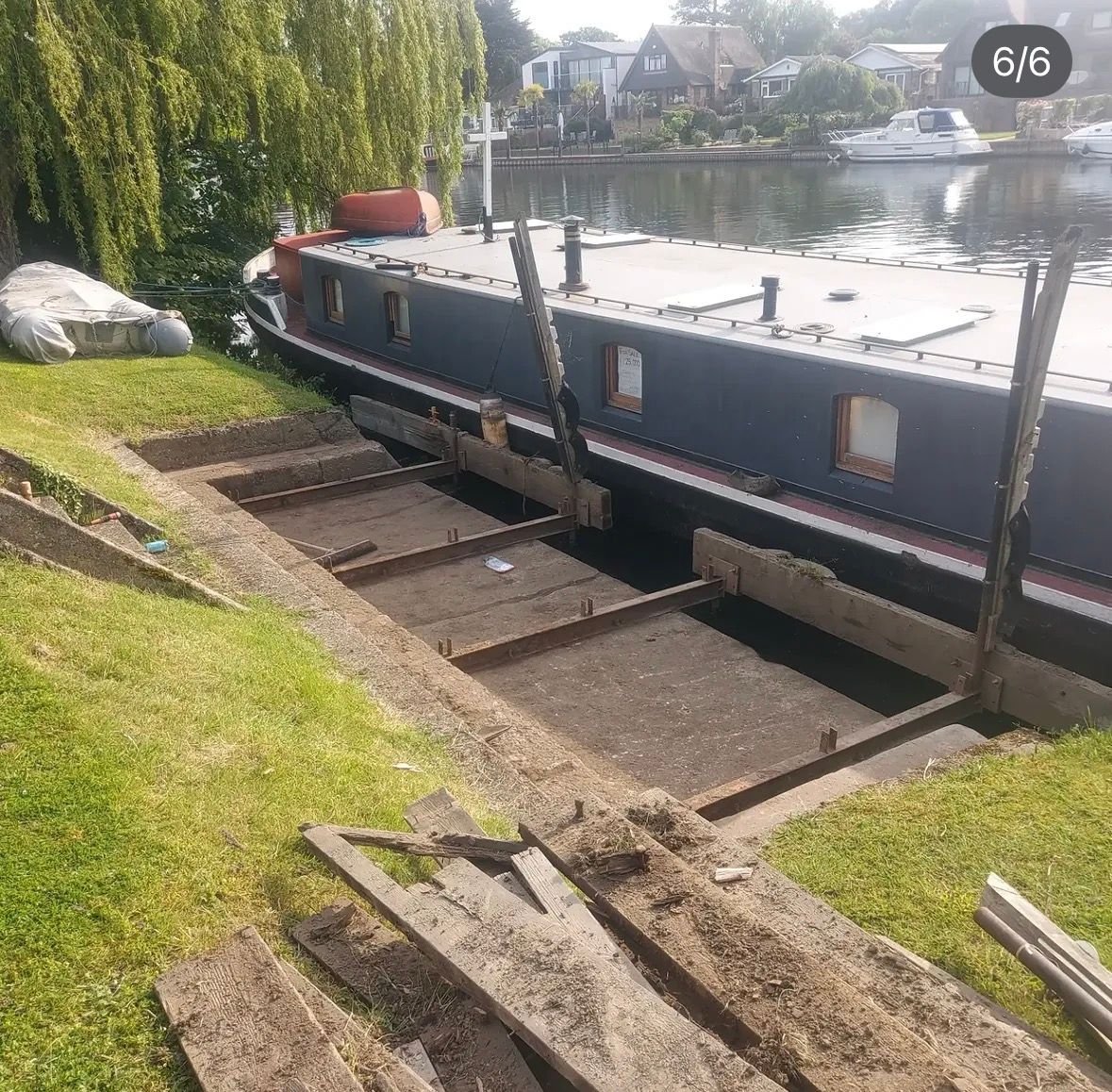 Riverside decking beside a houseboat