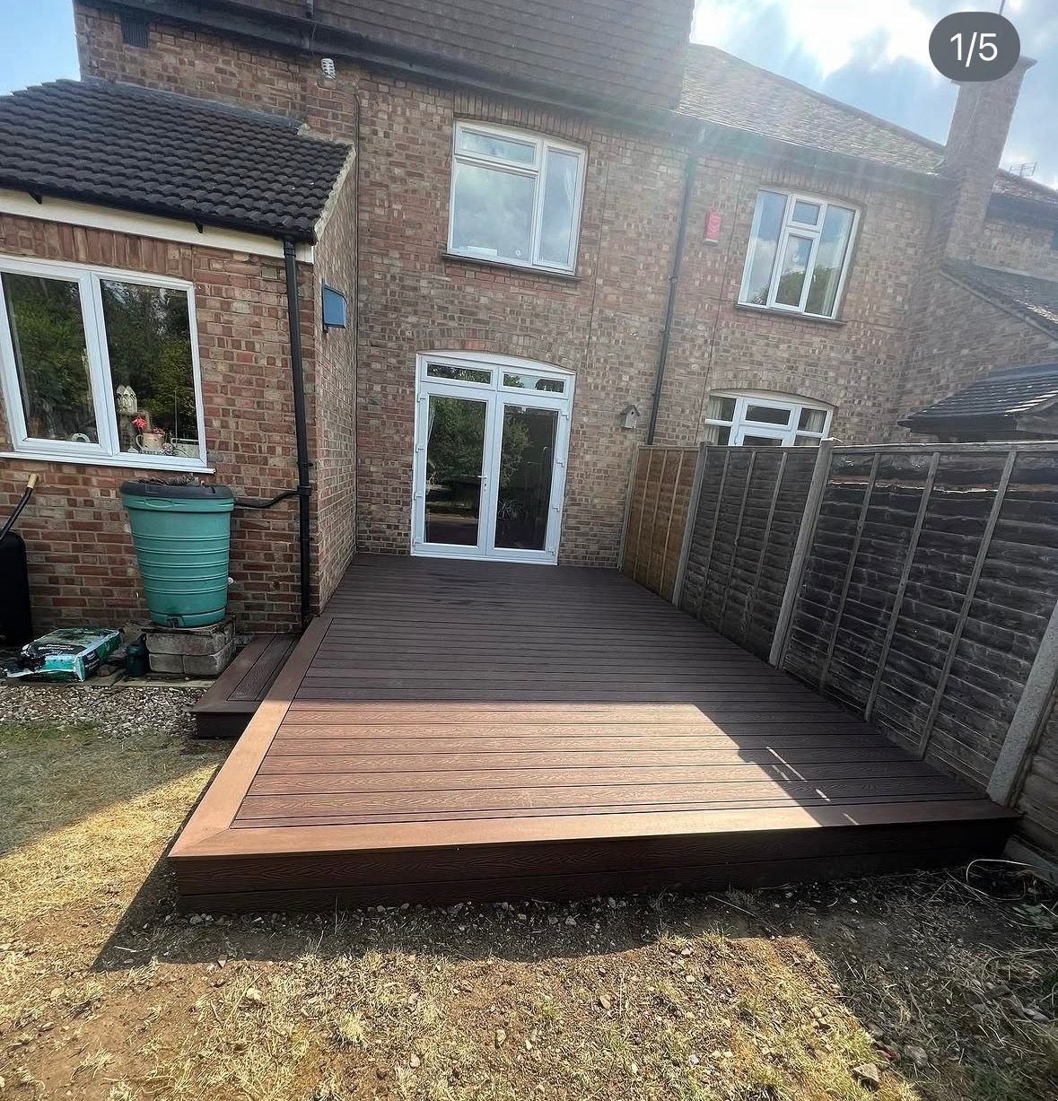 Composite deck beside a brick house