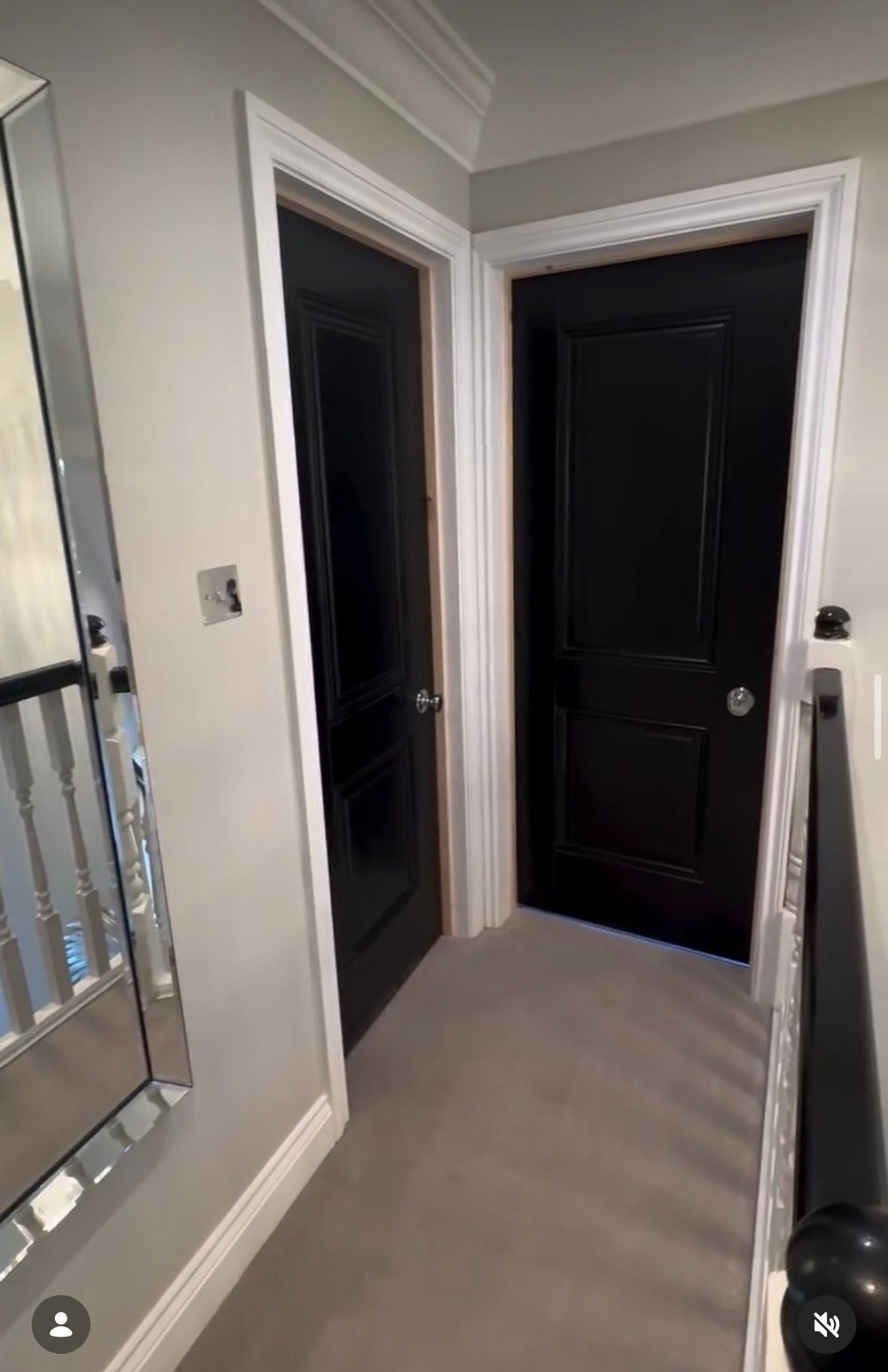Black internal door in a modern hallway