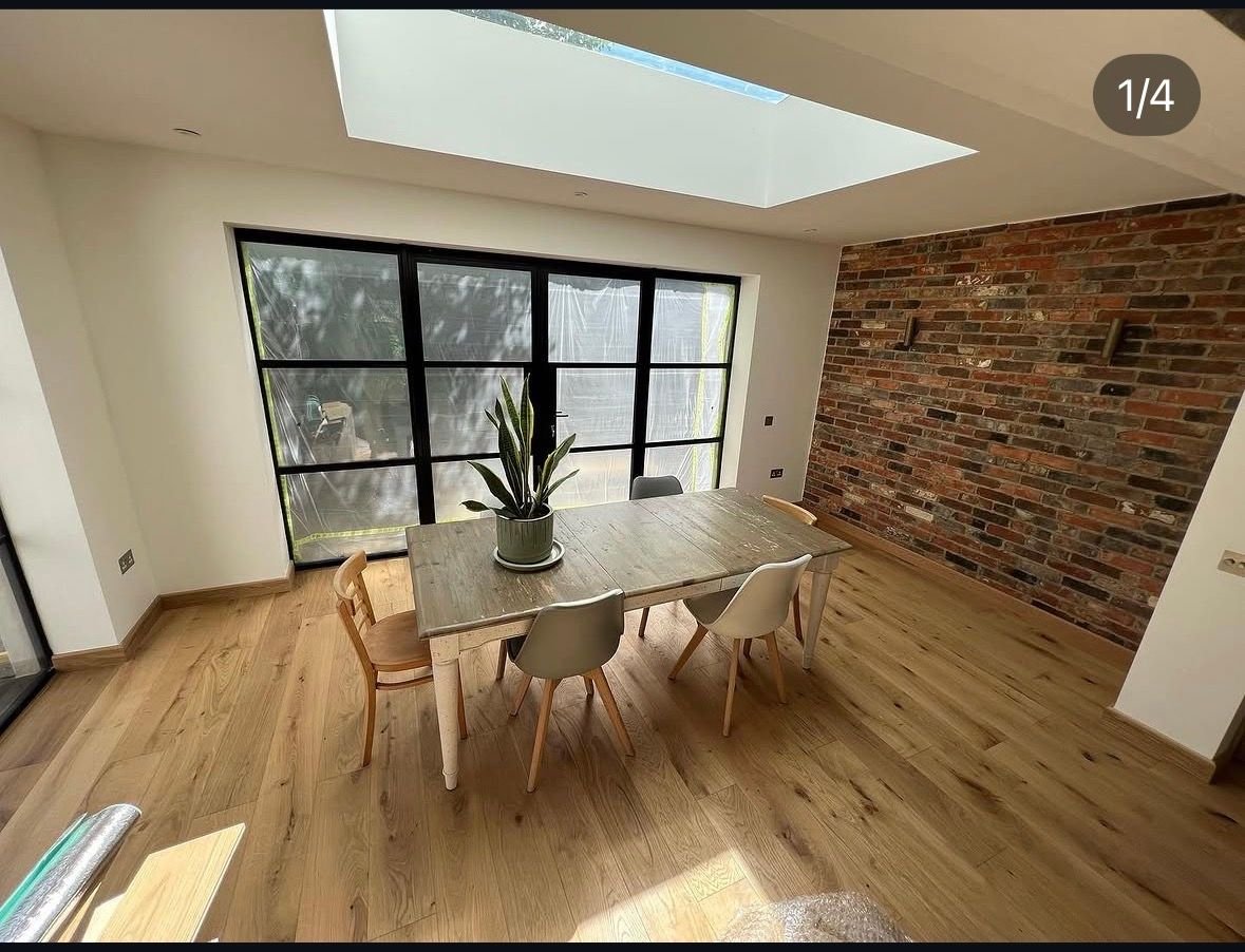 Wood floor in a dining area with a skylight