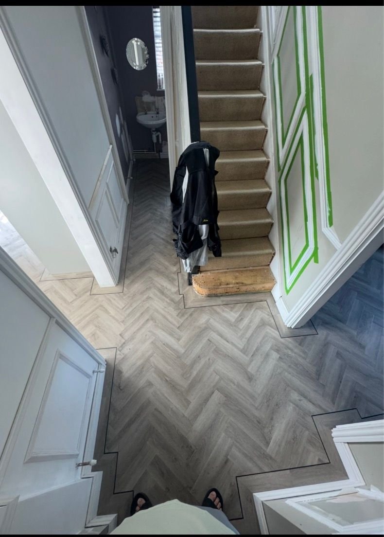 Herringbone wood floor in a hallway