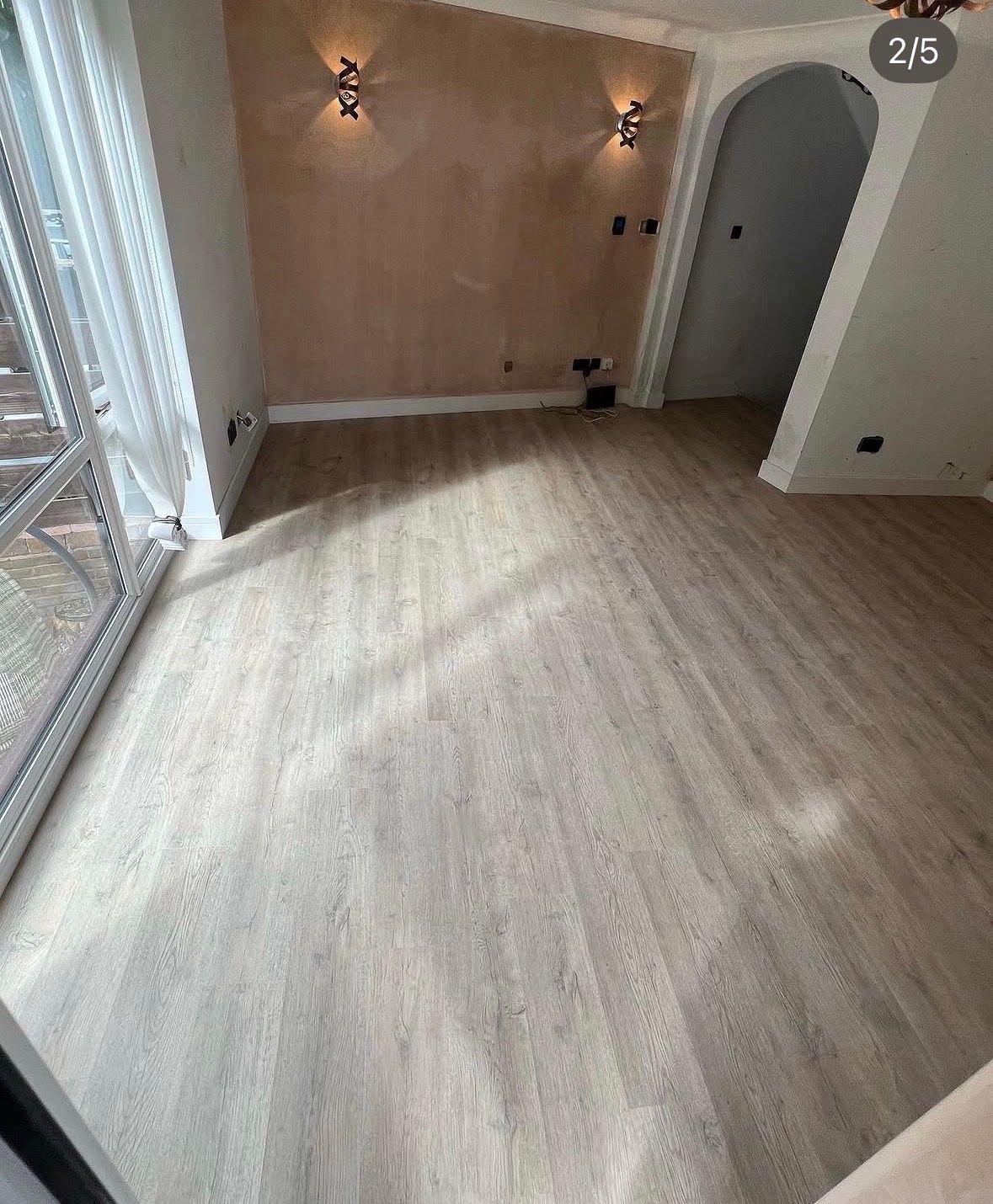 Grey wood-effect flooring in a large room