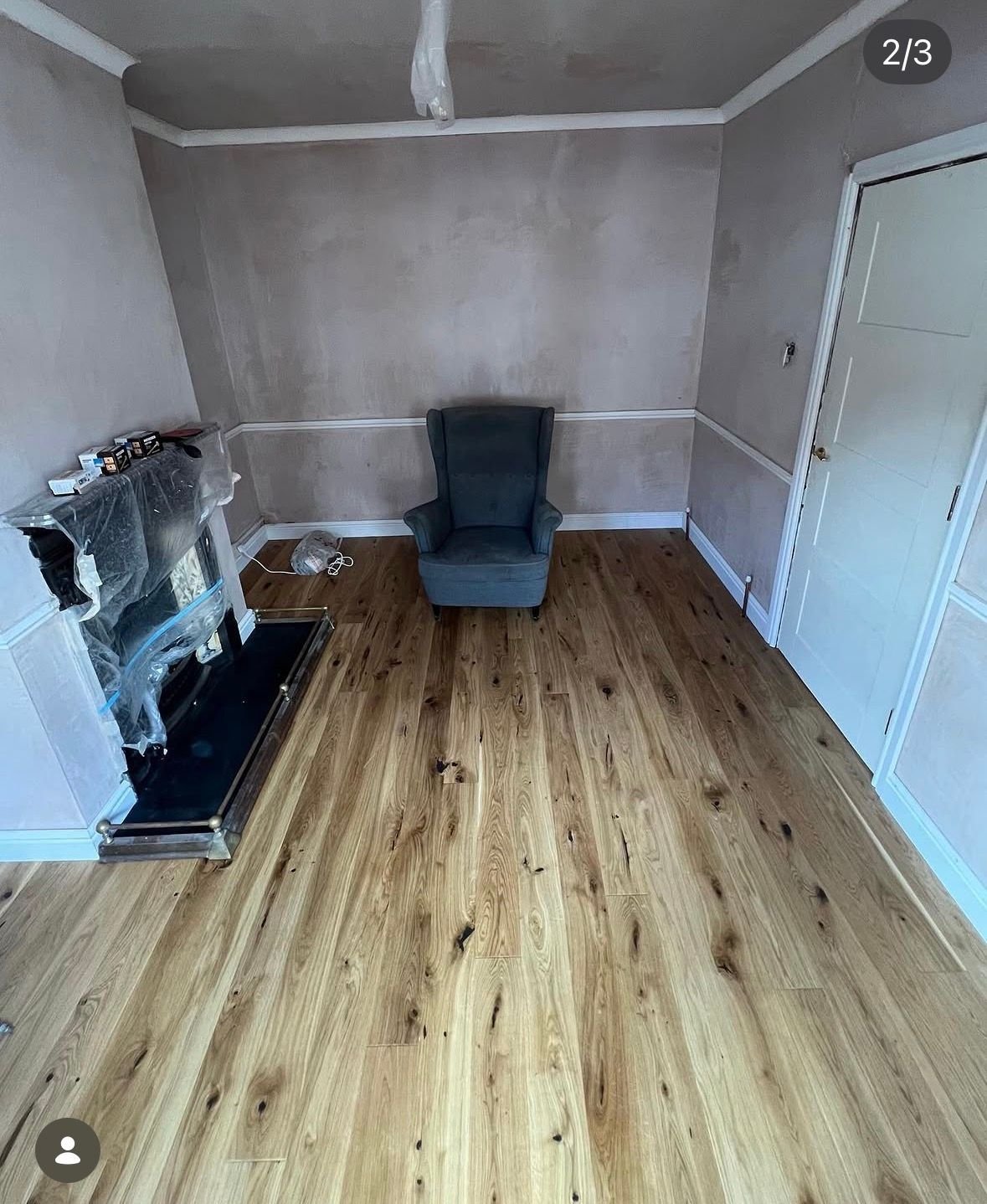Wood plank flooring against grey walls