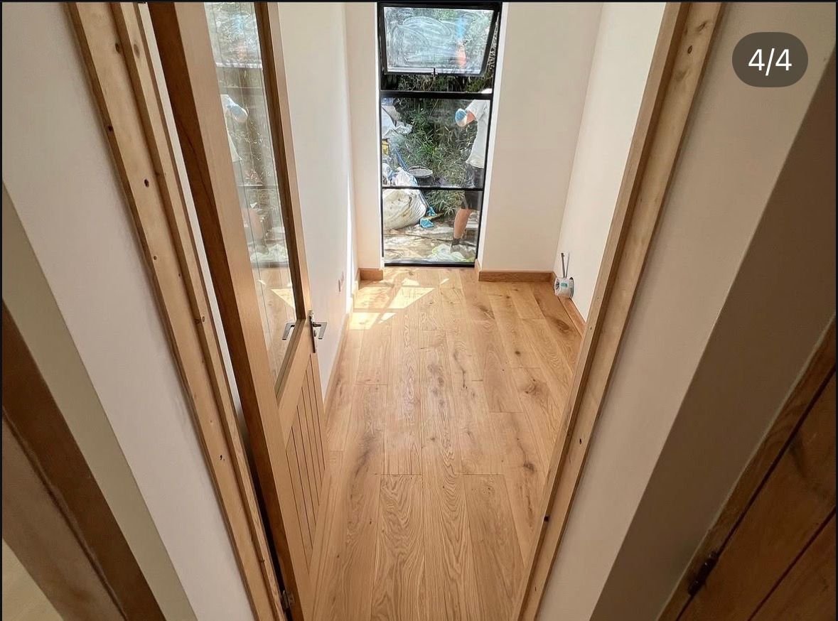 Wood floor finished at a doorway threshold