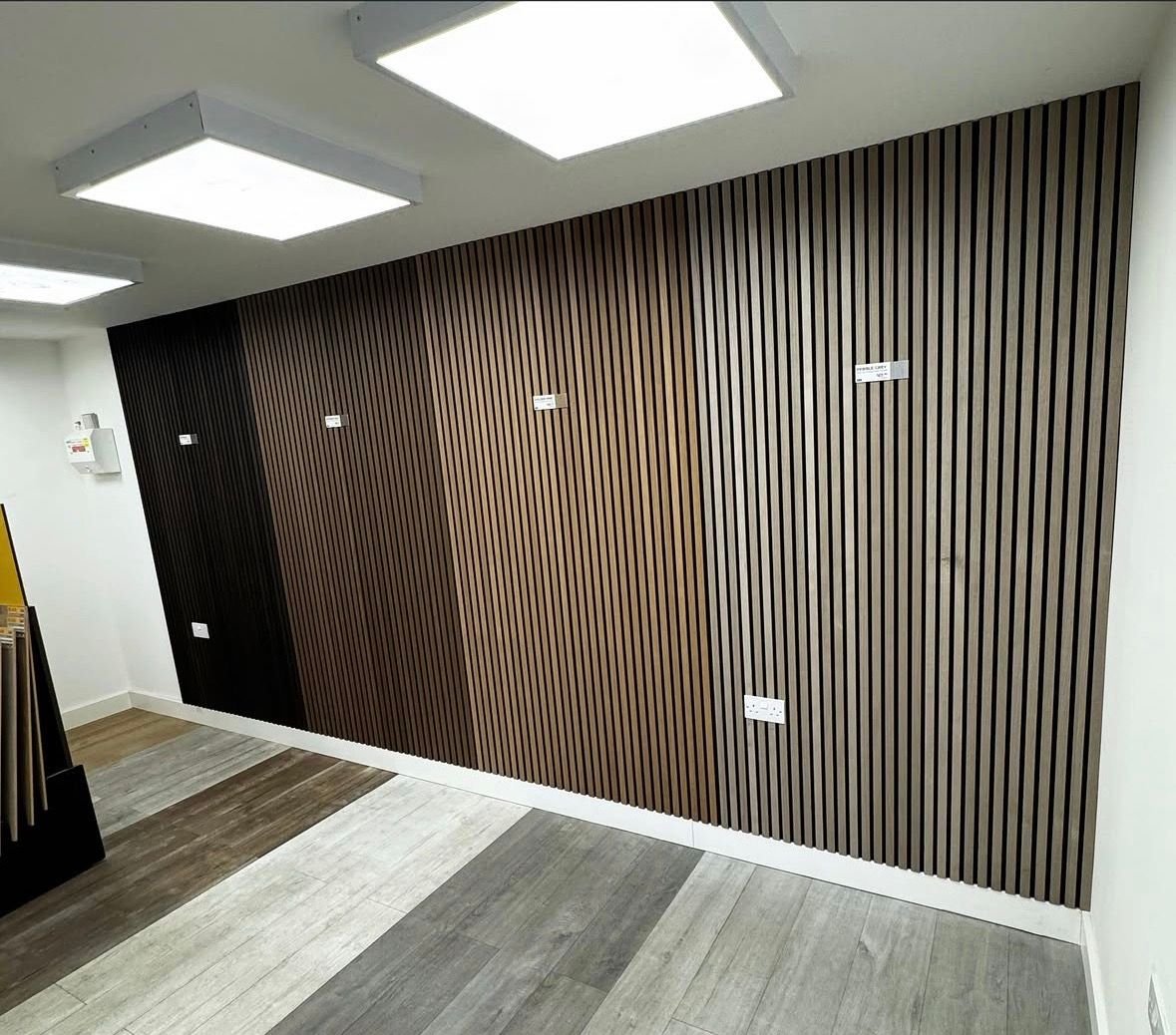 Dark slatted wall panelling in a large room