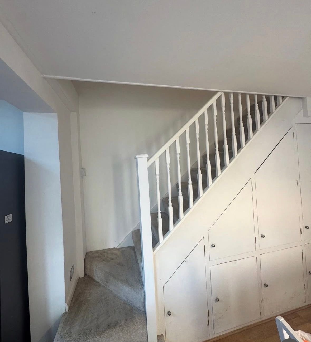 White staircase with under-stairs storage