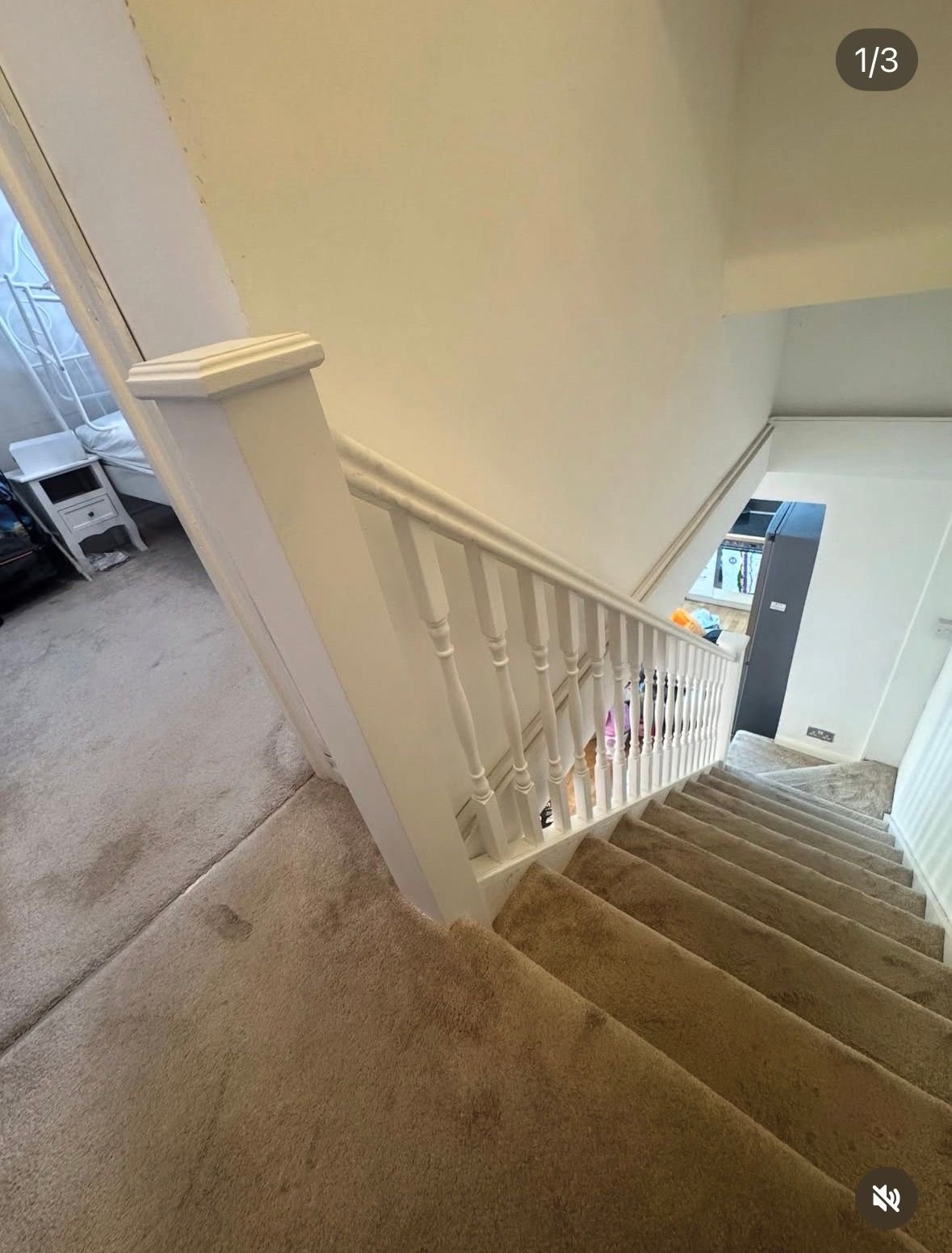 Renovated white staircase with new spindles