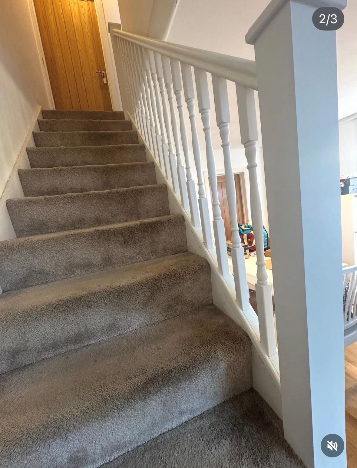 White staircase with grey carpet